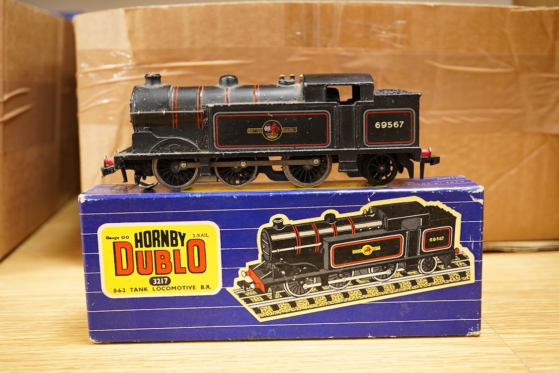 A collection of Hornby Dublo railway for 3-rail running, including three boxed locomotives; an LNER class A4 4-6-2 tender locomotive, Sir Nigel Gresley 7 (EDL1), a BR Duchess of Montrose 46232 (EDL12), and a BR class N2